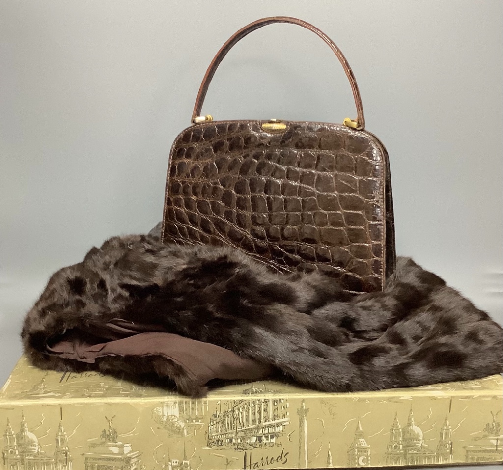 A Russell & Bromley brown crocodile effect handbag (made in France), a blond mink stole in Harrods box and a dark brown fur stole